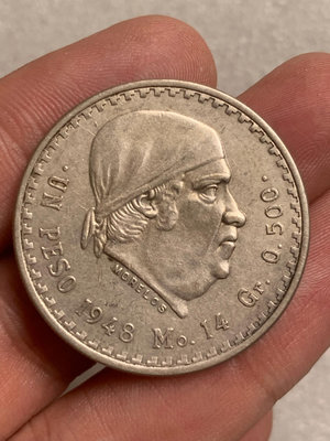 1948年墨西哥發行的小鷹洋莫雷洛斯1比索紀念銀幣，直齒絲邊
