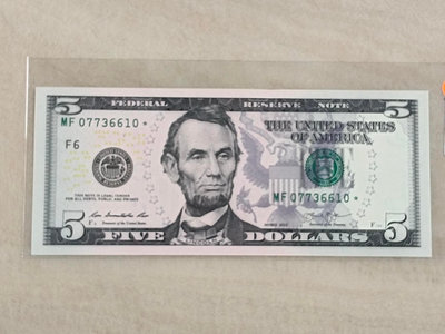 美國2013星號補號鈔99新無折5美金，保真