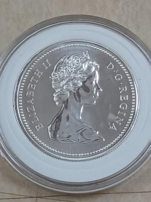 1976加拿大UNC銀幣DOLLAR 國會山莊落成100週年紀念幣1枚，保真。直徑36.1mm，重23.0克。