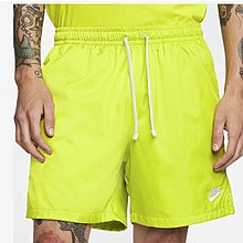 nike club essentials woven flow shorts yellow