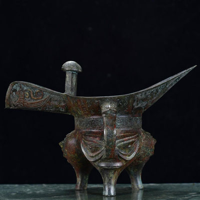 漢代青銅人面爵杯 長30厘米 ，寬18厘米 ，高20厘米，重1700克6601235
